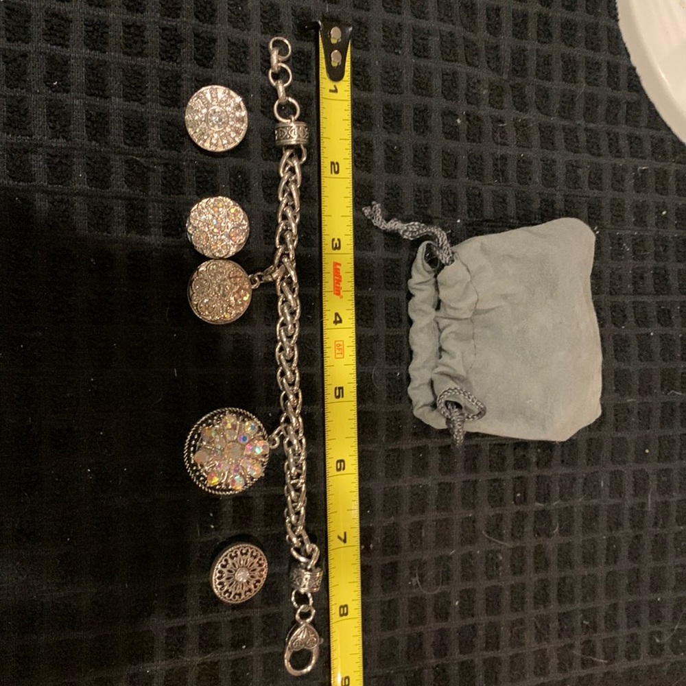 Snap Bracelet Silver in color with 6 interchangeable snap buttons